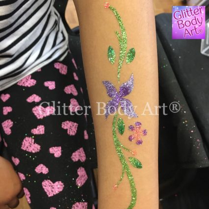 large floral glitter tattoo on a girls arm, pretty floral design temporary tattoo