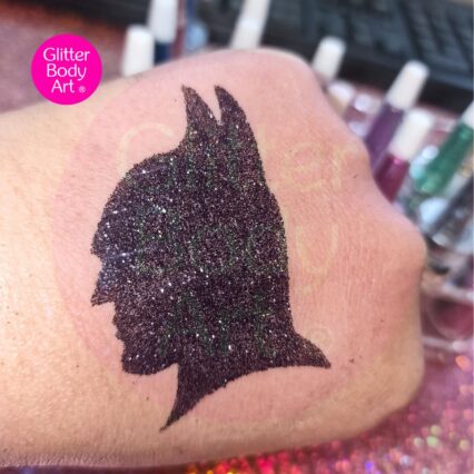 batman glitter tattoo created using stencil and glitter