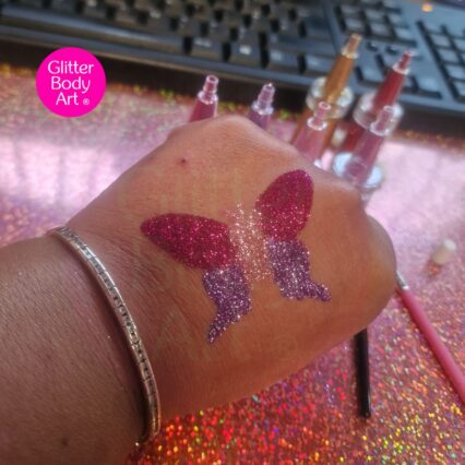 butterfly glitter tattoo stencil created with pink and purple glitter